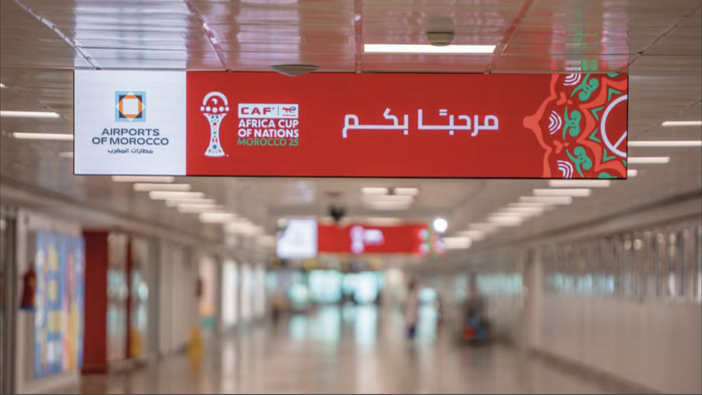 AFCON 2025 welcome sign at Casablanca Mohammed V Airport for arriving football fans
